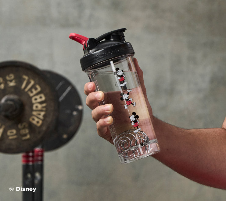 pro-series-j4 Mickey_Mouse_Protein_Shaker_Bottle_Being_Held_In_the_Gym.jpg